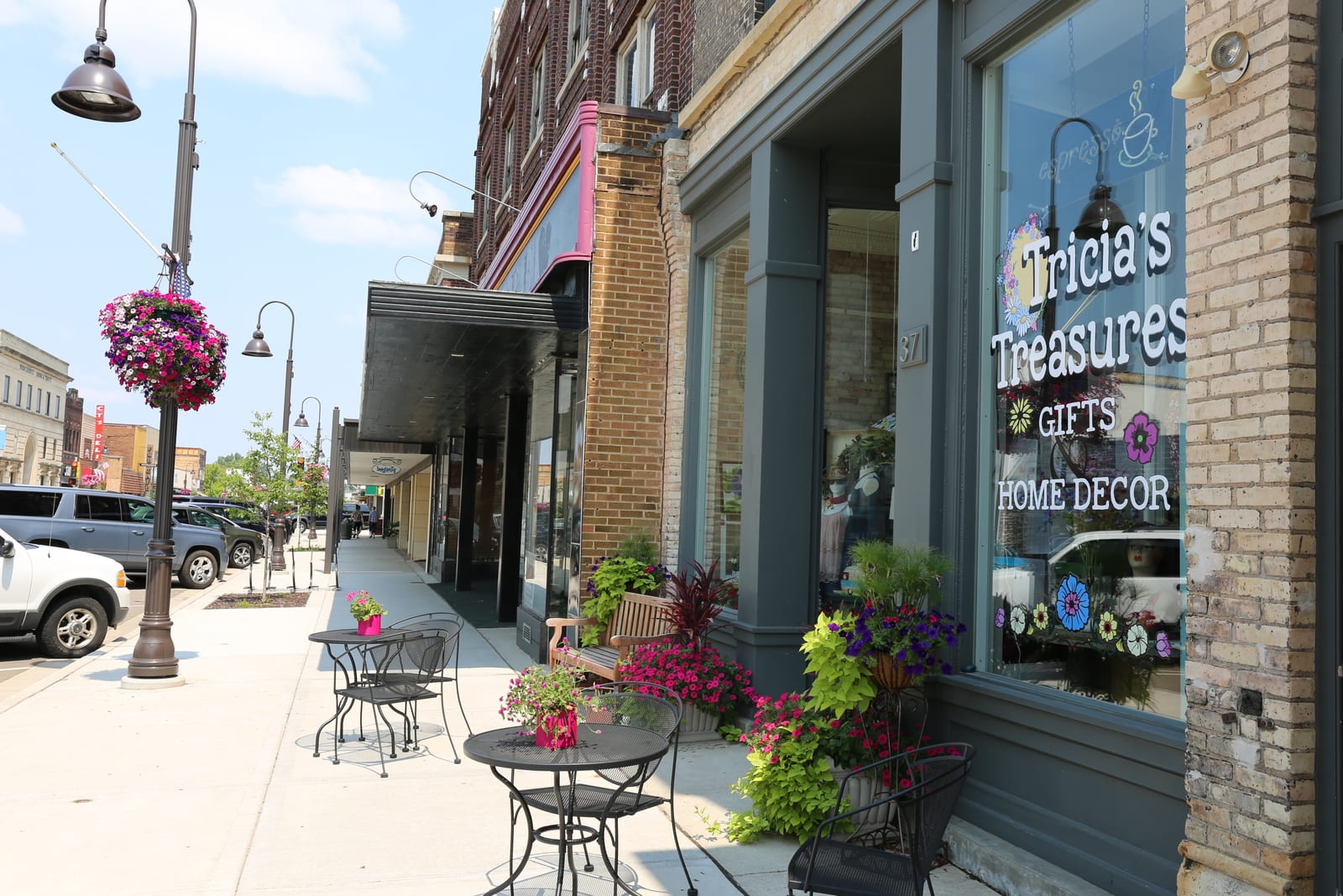 Street view of a quaint downtown area with a variety of shops and outdoor seating in Oneida County, Wisconsin